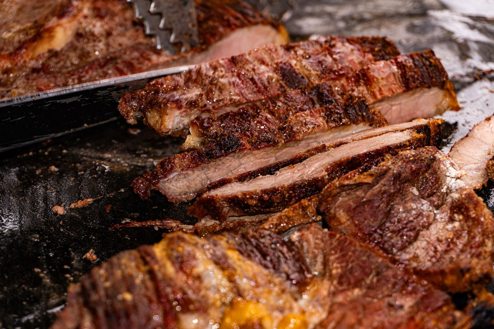 Sliced grilled bavette steak with a seared crust